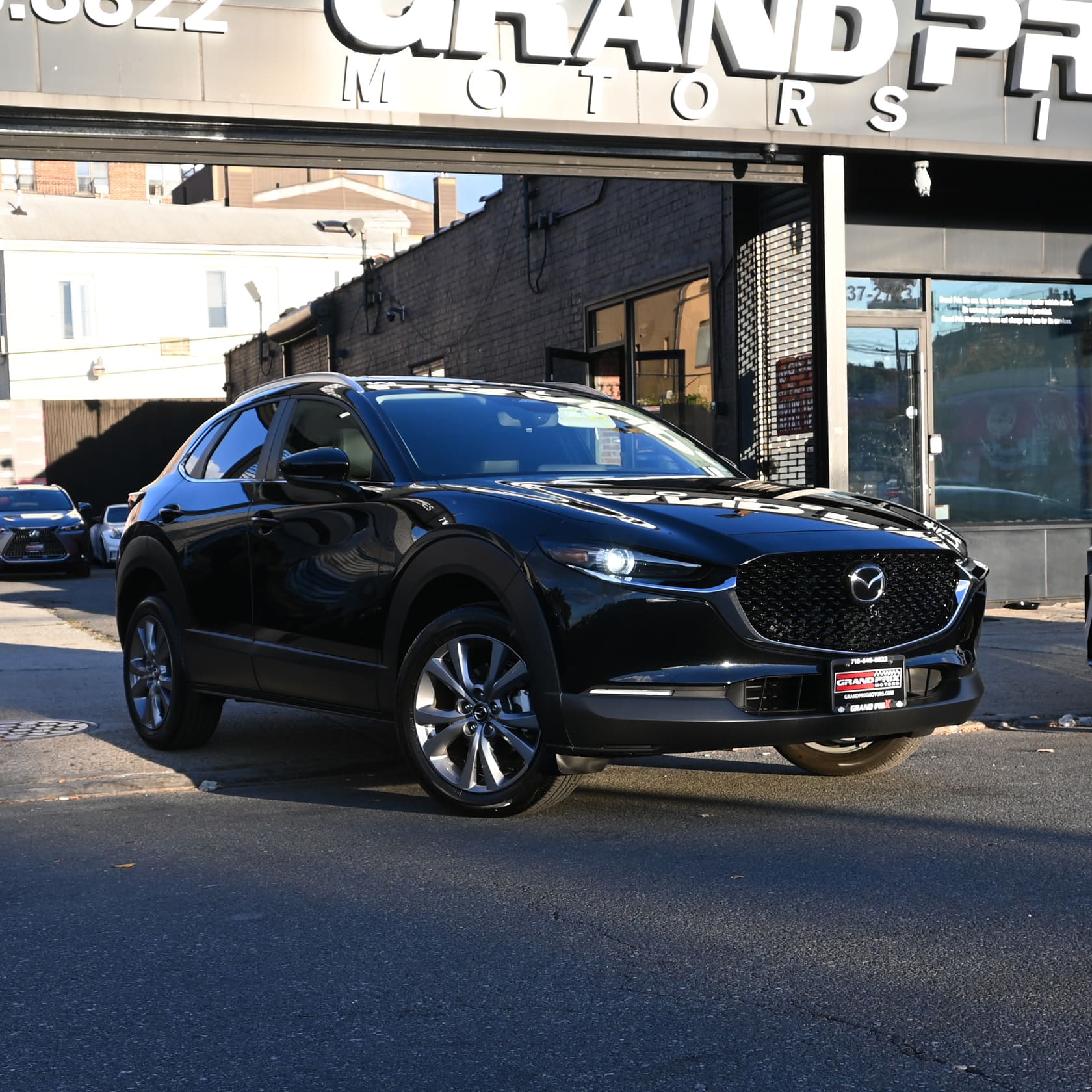 Black 2026 Mazda CX-30 parked at Grand Prix Motors